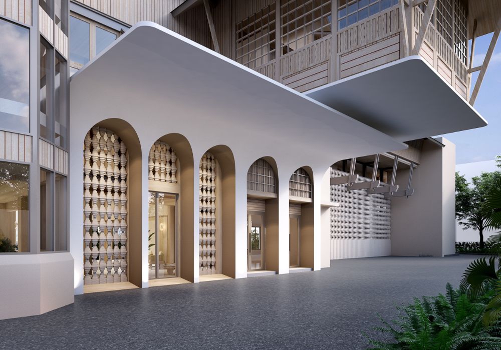 Beachfront wellness resort designed by Openbox Architects featuring a bright open lobby with ocean views, natural light through glass roof, and warm coastal materials.