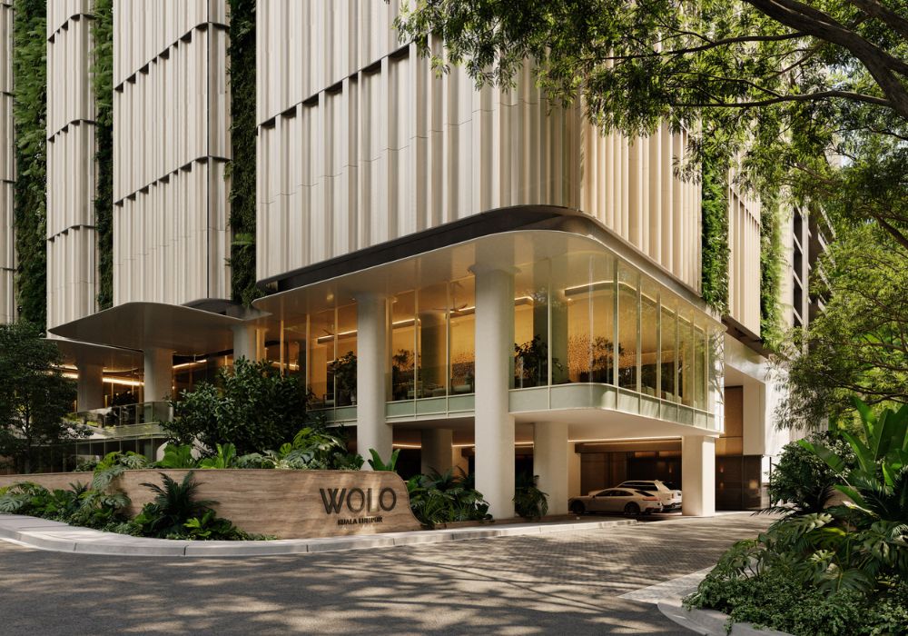 Architectural facade of WOLO in Kuala Lumpur featuring vertical clay inspired panels, soft curved textures, and a modern high rise form that reflects the city’s layered earth, cultural diversity, and fluid design concept by Openbox Architects.